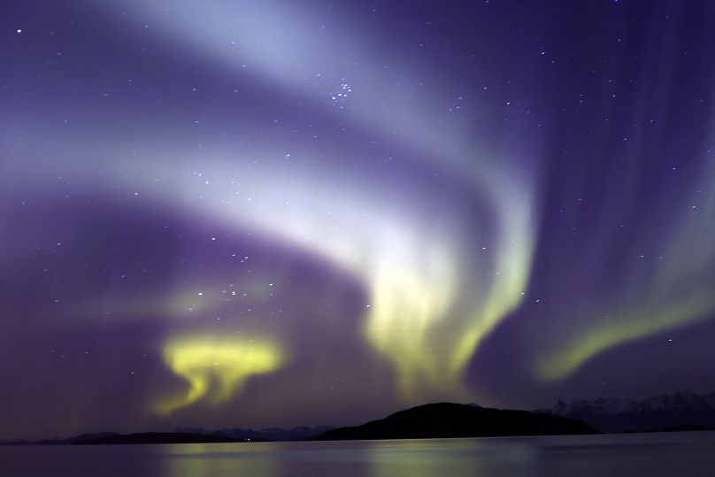 The aurora borealis, or Northern Lights, are seen over the Norwegian town of Harstad, Wednesday, Oct. 7, 2015.