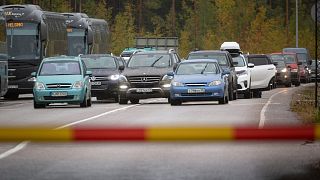 Russian cars and buses line up at the Vaalimaa border check point between Finland and Russia in Virolahti, Finland, Friday, Sept. 30, 2022.