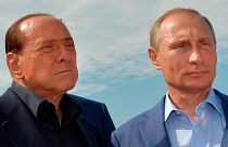 Russian President Vladimir Putin, right, and former Italian Prime Minister Silvio Berlusconi visit a memorial to the soldiers from Sardinia killed in the Crimean War, near Mou