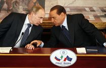 Italian former Premier Silvio Berlusconi, right, and Russian Prime Minister Vladimir Putin talk during a press conference near Milan, Italy. 26 April 2010