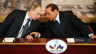 Italian former Premier Silvio Berlusconi, right, and Russian Prime Minister Vladimir Putin talk during a press conference near Milan, Italy. 26 April 2010