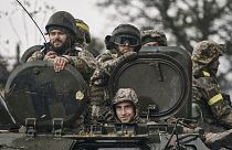 Ukrainian soldiers ride an APC in Donetsk region, 20 October 2022