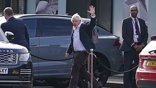 Former Prime Minister Boris Johnson arrives at Gatwick Airport in London, after travelling on a flight from the Caribbean, 22 October 2022