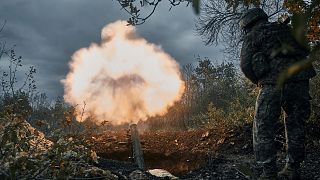 Ukrainian soldiers fire the Russian positions with the mortar in Bakhmut, Donetsk region, Ukraine. Friday, 21 October 2022.