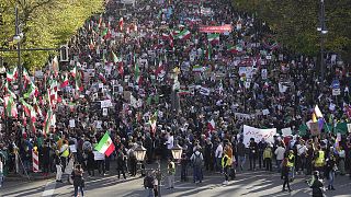 People attend a protest against the Iranian regime, in Berlin, 22 October 2022