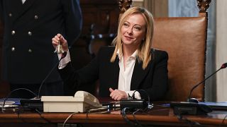 Georgia Meloni rings small bell ahead of her first cabinet meeting