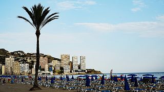A view of sunbeds lined up on the beach, in Benidorm, July 2020