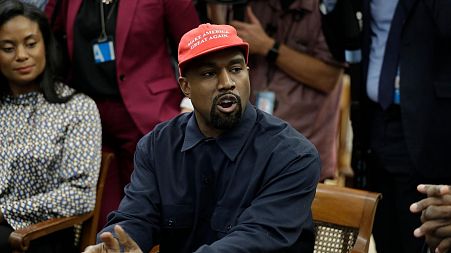 Rapper Kanye West speaks to President Donald Trump and others in the Oval Office of the White House, Thursday, Oct. 11, 2018