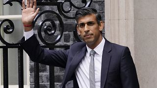 New British Prime Minister Rishi Sunak waves after arriving at Downing Street in London