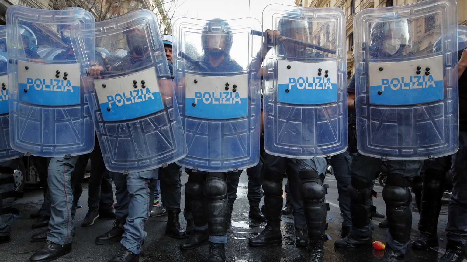 Police officers face demonstrators protesting on the sidelines of a G20 environment meeting, in Naples, Italy. Thursday 22 July 2021. Police officers face demonstrators protesting on the sidelines of a G20 environment meeting, in Naples, Italy. Thursday 22 July 2021.