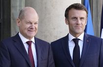 French President Emmanuel Macron welcomes German Chancellor Olaf Scholz at the Elysee Palace in Paris 26 October 2022