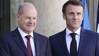 French President Emmanuel Macron welcomes German Chancellor Olaf Scholz at the Elysee Palace in Paris 26 October 2022
