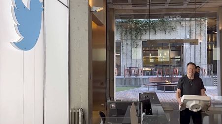 This image from the Twitter page of Elon Musk shows Musk entering Twitter headquarters carrying a sink through the lobby area on Wednesday, Oct. 26, 2022 in San Francisco.