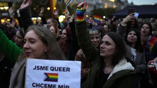 Protesters in Prague held signs reading "We are queer, we want peace."