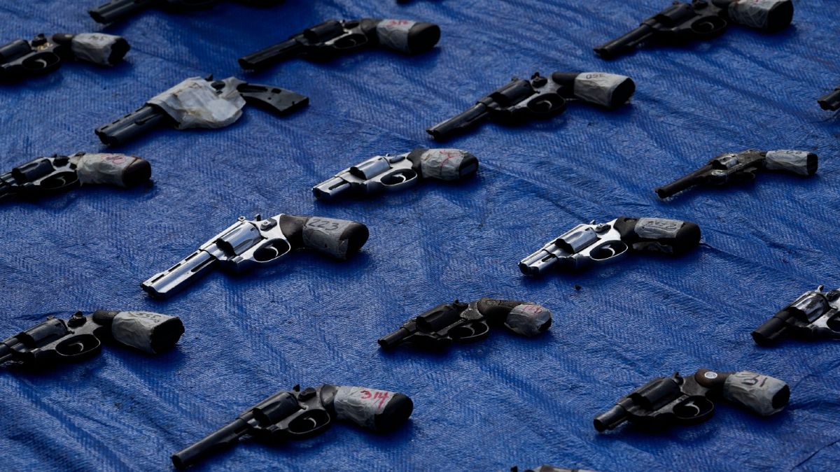 Seized pistols are presented to the media before they are set to be destroyed at police headquarters in Panama City, Aug. 26, 2022.