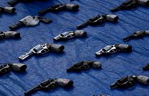 Seized pistols are presented to the media before they are set to be destroyed at police headquarters in Panama City, Aug. 26, 2022.