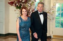 FILE: House Minority Leader Nancy Pelosi of Calif., and her husband, Paul, arrive for a state dinner at the White House, Tuesday, April 28, 2015