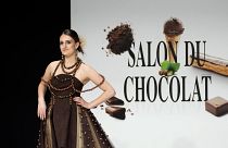 A model presents a chocolate studded dress