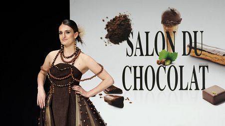 A model presents a chocolate studded dress