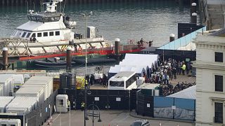 migrants wait to be processed at the Border Force compound in Dover, after being brought from Border Force vessels after small boat incidents in the Channel, Oct. 29, 2022.