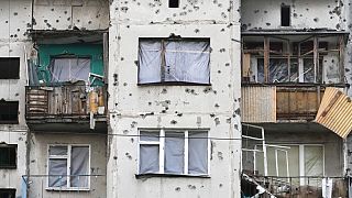 Traces of shrapnel from the Russian rockets cover a multi storey house in central Slavyansk, Donetsk region, Ukraine, Saturday, Oct. 29, 2022.