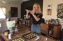 American librarian Rosie Grant filming cookies for her TikTok. 