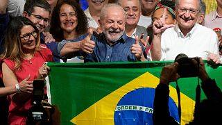 Former Brazilian President Luiz Inacio Lula da Silva celebrates with his wife Rosangela Silva, left, and running mate Geraldo Alckmin, Sao Paolo, 30 October 2022