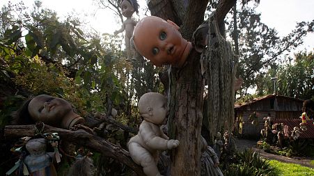 Dolls hang from trees at the Island of the Dead Dolls in Xochimilco, Mexico City