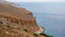 The coast of Crete. A woman has died after being crushed by a giant rock while she slept in a coastal hotel.