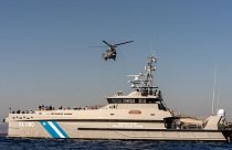 Helicopters and coast guard boats are involved in the search and rescue operations.
