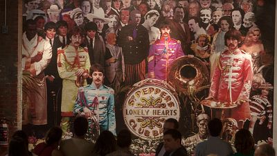 A painting that likely inspired The Beatles' Sgt. Pepper album was sold last week for over €50,000.