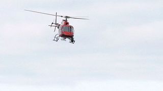 A helicopter flies over Bergen in Norway.