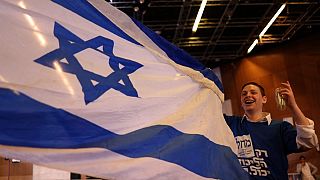 Israel's Likud party supporters react at their campaign headquarters in Jerusalem on November 1, 2022.