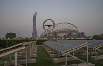 Solar panels stand on grounds in front of Khalifa International Stadium, which will host matches during the FIFA World Cup 2022, in Doha, Qatar, Saturday, Oct. 15, 2022.