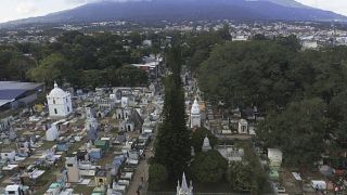 General view of the Nueva San Salvador Cemetery, with the San Salvador volcano in the background, during the Day of the Dead celebrations in Santa Tecla, El Salvador, Wednesda