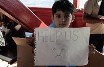 Акция гуманитарных организаций с призывом помочь нелегальным мигрантам, спасённым в Средиземном море на пути в Европу