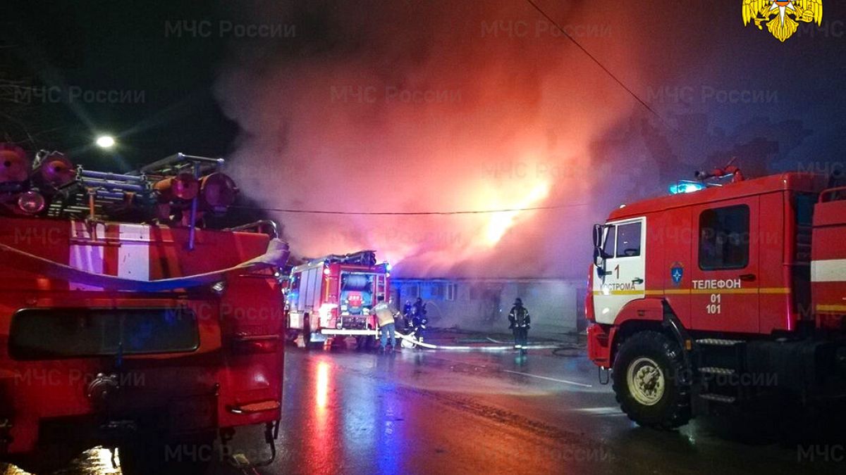 Firefighters try to extinguish a fire at a cafe in Kostroma, Russia, Saturday, Nov. 5, 2022. 