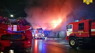 Firefighters try to extinguish a fire at a cafe in Kostroma, Russia, Saturday, Nov. 5, 2022. 