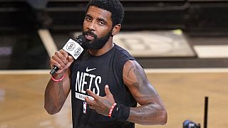 Brooklyn Nets guard Kyrie Irving speaks before an NBA game in New York