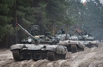 Ukrainian soldiers on captured Russian tanks T-72 hold military training close to the Ukraine-Belarus border near Chernihiv, 28 October 2022