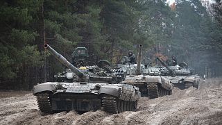 Ukrainian soldiers on captured Russian tanks T-72 hold military training close to the Ukraine-Belarus border near Chernihiv, 28 October 2022