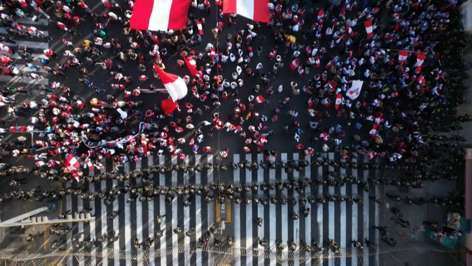 Police officers and protesters in a tense stand-off in Peru's capital 