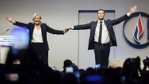 French far right leader Marine Le Pen celebrates with newly elected leader of the National Rally president Jordan Bardella during the party congress in Paris, 5 November 2022