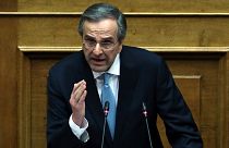 Former Greek Prime Minister Antonis Samaras delivers a speech during a parliament session in Athens, Feb. 21, 2018.