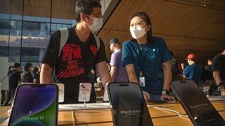 Customers shop at an Apple Store on the first day of sale for the Apple iPhone 14 in Beijing, China, Friday, Sept. 16, 2022. 