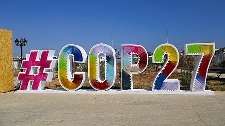 Signage promoting the COP27 U.N. Climate Summit is displayed in the Green Zone, in Sharm el-Sheikh, Egypt, Monday, Nov. 7, 2022.