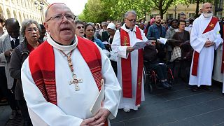 FILE: Archbishop of Bordeaux Jean-Pierre Ricard (L) celebrates the Passion of Christ on Good Friday in Bordeaux, southwestern France, on April 14, 2017.