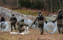 Polish soldiers begin laying a razor wire barrier along Poland’s border with the Russian exclave of Kaliningrad in Wisztyniec, Poland.