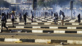 Sudanese police and demonstrators clash in the capital, Khartoum