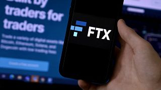 This illustration photo shows a smart phone screen displaying the logo of FTX, the crypto exchange platform.